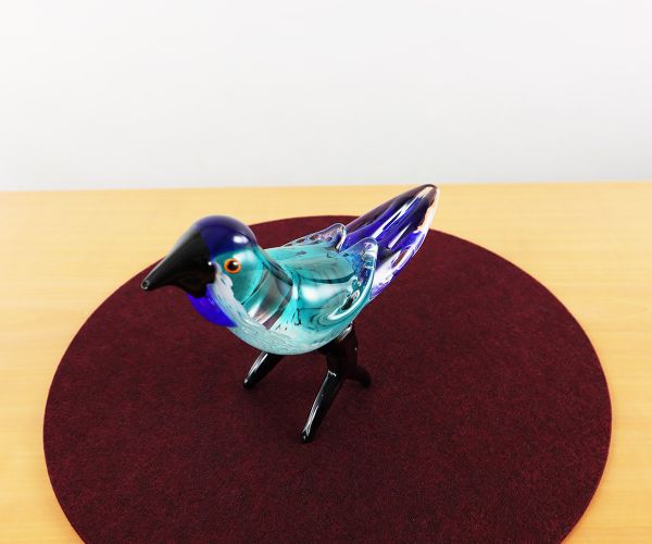 Glastier blauer Vogel